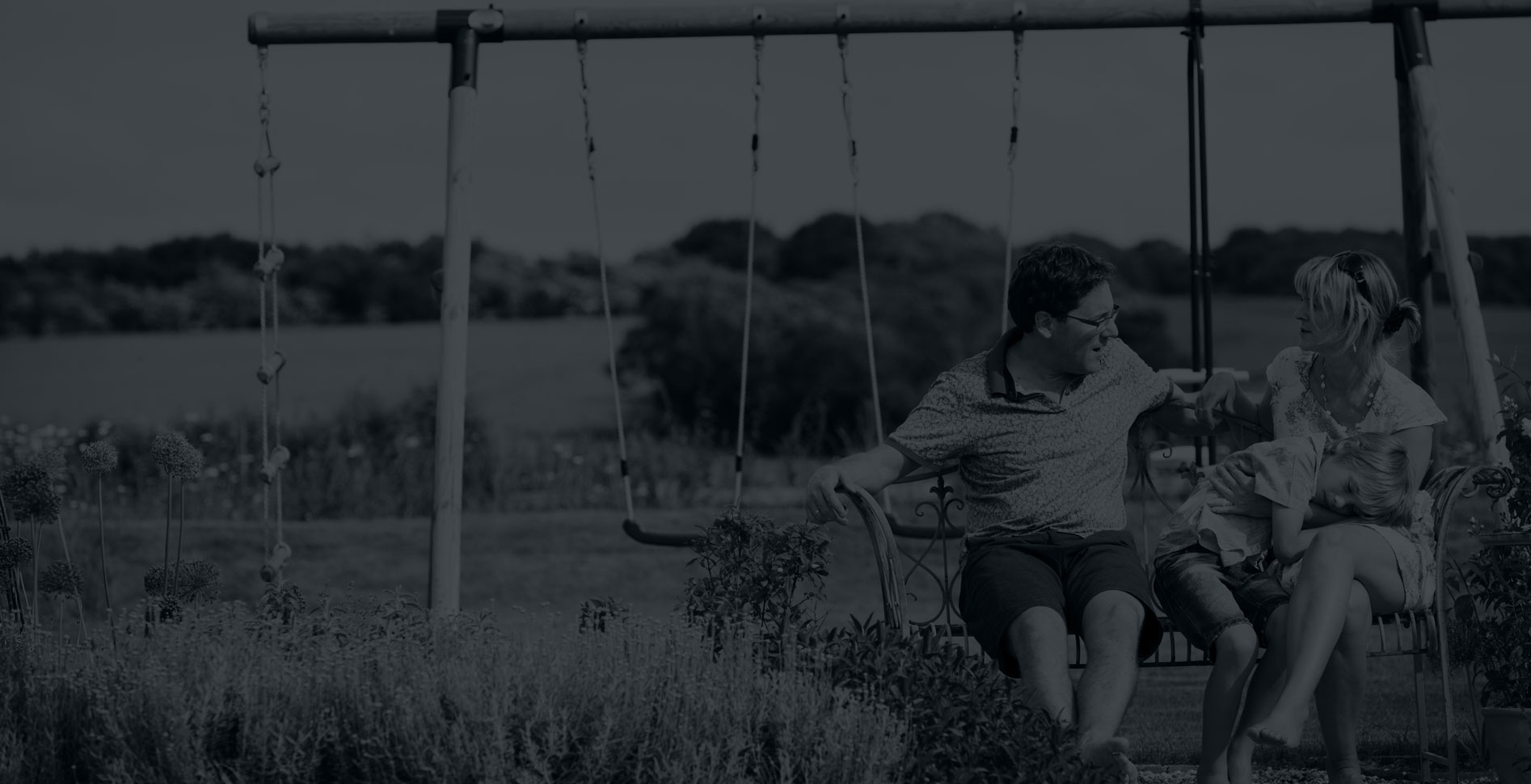 Slider-Image-1894x970_3 A family talking sitting on a swing - Small Talk Big Difference