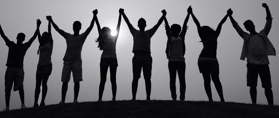 A group of people with their hands in the air - Small Talk Big Difference